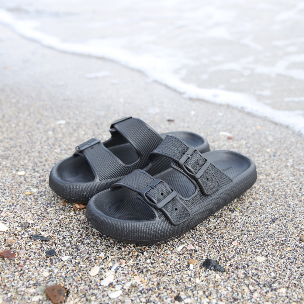 Tan sandals on bedding